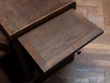 a wooden table with a drawer underneath it on a hard wood floor