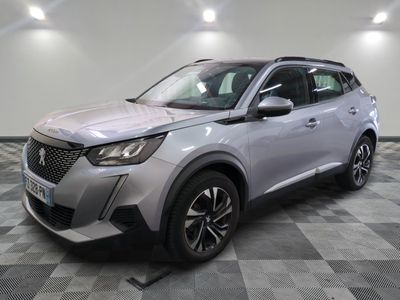 a silver suv parked on a checkered floor in a garage