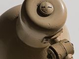 a brown fire hydrant that is on a white surface