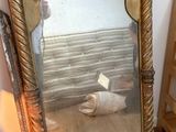 a mirror that is sitting on the floor in a room