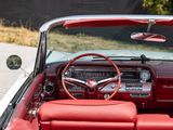 a red convertible car with a steering wheel and dashboard
