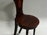 an image of a wooden chair with a wooden seat on a white surface