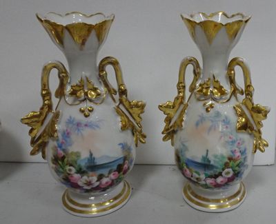 two vases that have been painted with flowers on them