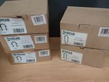 three boxes are stacked on top of each other on a table