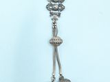 silver plated necklace with bells and beads on a mannequin mannequin mannequin mannequin mannequin mannequin mannequin mann