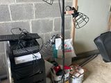 an image of a room with a desk, chair, and lamp