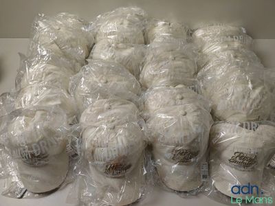 many balls of yarn wrapped in plastic bags on a table