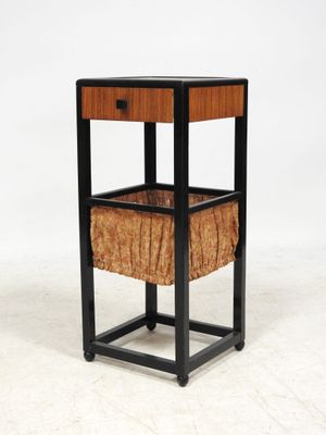 an image of a wooden and metal side table with a basket on top