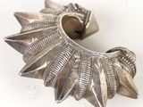 a silver metal object that is sitting on a table