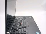 a laptop that is open on a white surface