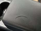 a close up of a car seat with a cup holder