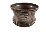 an image of a silver bowl with a decorative design on it