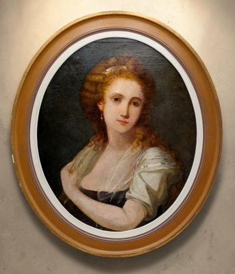 portrait of a woman in a black dress in a round frame