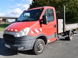 a red truck that is parked in a parking lot