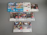 a lot of nintendo wii games on the table