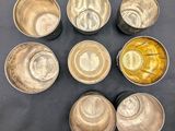 six bowls of different sizes and shapes are arranged in a circle