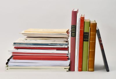 a stack of books sitting next to each other on a table