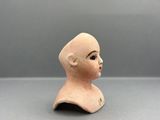 a close up of a clay head of a child