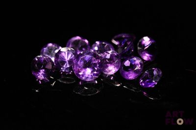 purple amethorate faceted beads on a black background