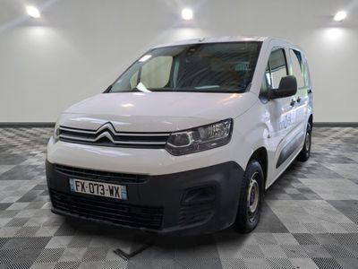 the white van is parked on a checkered floor in a room