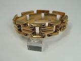 gold plated bracelet with square links on clear acrylic base