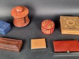 five small boxes and a small box on a table
