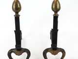 a pair of antique brass candlesticks on cast iron bases