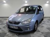 a picture of a small blue car parked in a garage