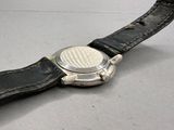 a close up of a watch on a black leather strap