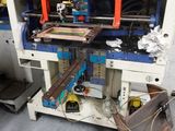 an image of a machine that is working on a piece of wood