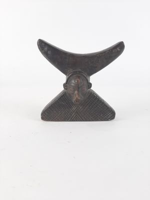 a close up of a sculpture of a whale ' s fin on a white background