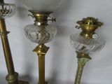 three lamps that are sitting on a table