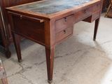 a wooden table with a marble top on it