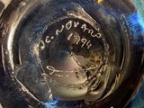 a close up of a glass of water with a label on it
