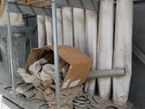 a pile of toilet paper on a cart in a room