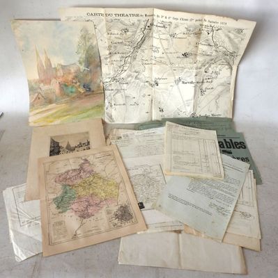 many old maps on the table and papers on the table