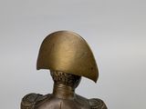 bronze statue of a roman soldier with a helmet on top of his head