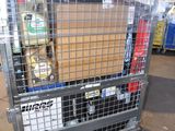 a large metal cart with a lot of items inside of it