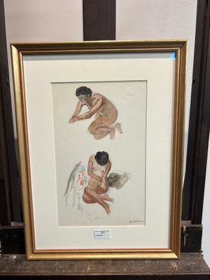 tableau représentant deux nus, dans un cadre doré, posé sur une table en marbre