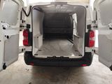 a white van with its doors open in a garage