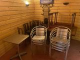 two chairs and a table in the corner of a room