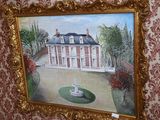 une photo d'un tableau représentant une maison accroché au mur