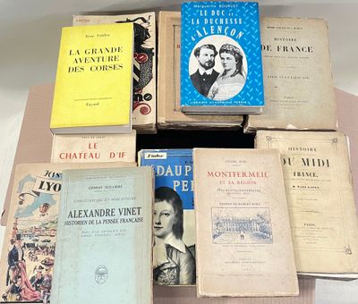 several books are stacked on top of each other on a table
