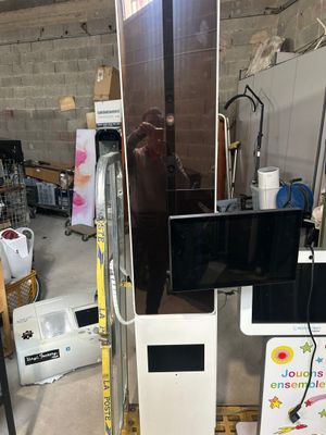 a picture of a refrigerator with a television on top of it