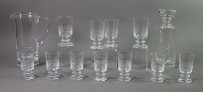 a lot of glasses and a pitcher on the table