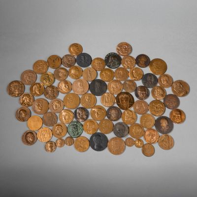 a pile of coins on a table with a white background