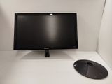 un écran d'ordinateur posé sur un bureau blanc