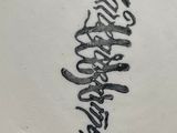 a white plate with a black writing on it