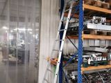 a large rack with many items in it in a warehouse