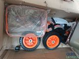 a cardboard box with a toy truck inside of it